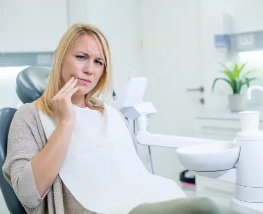 Patient with a toothache in the dental chair